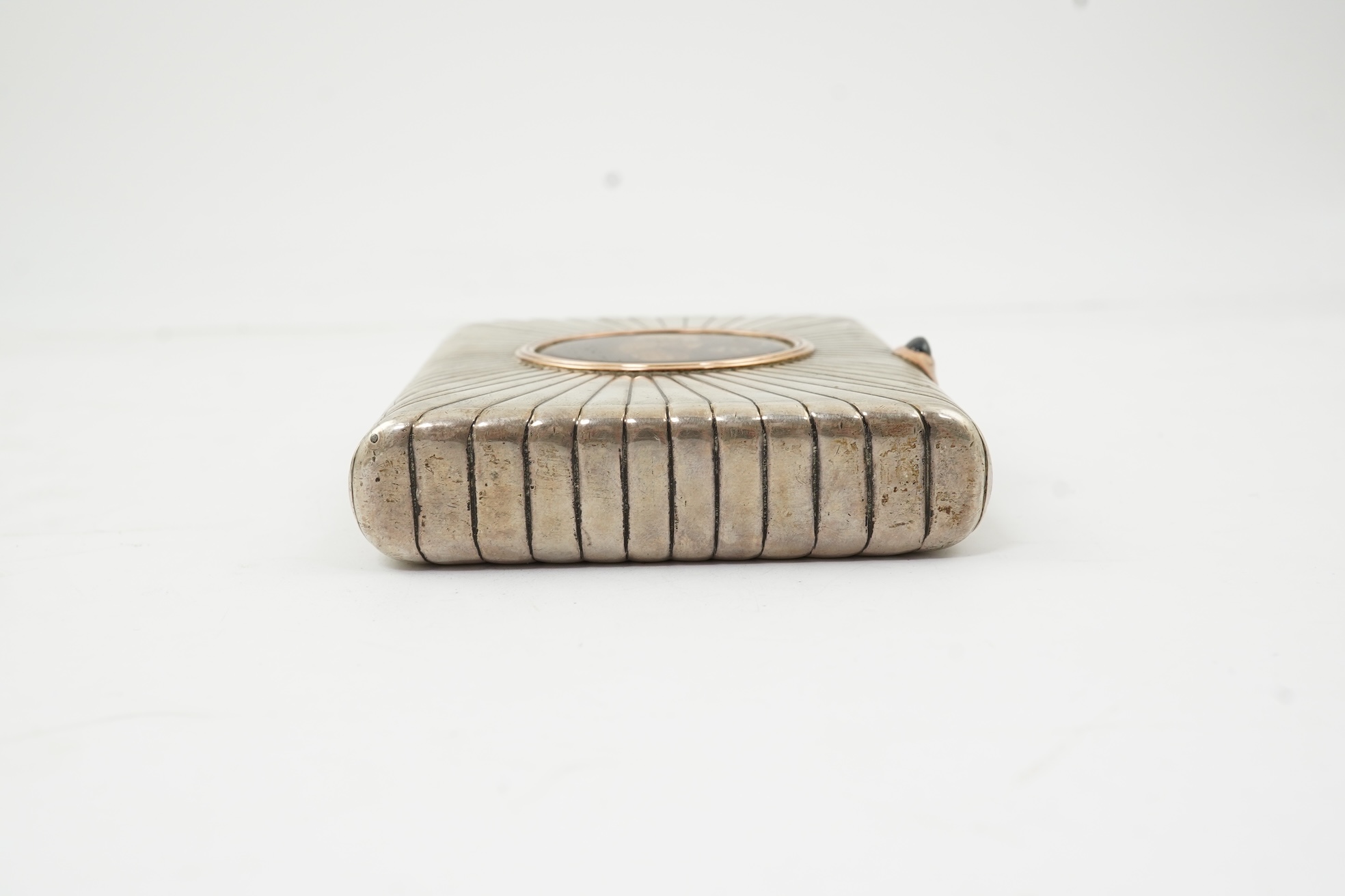 An early 20th century Russian 84 zolotnik silver cigarette case, with cappuccino agate inset cover, of ribbed rectangular form